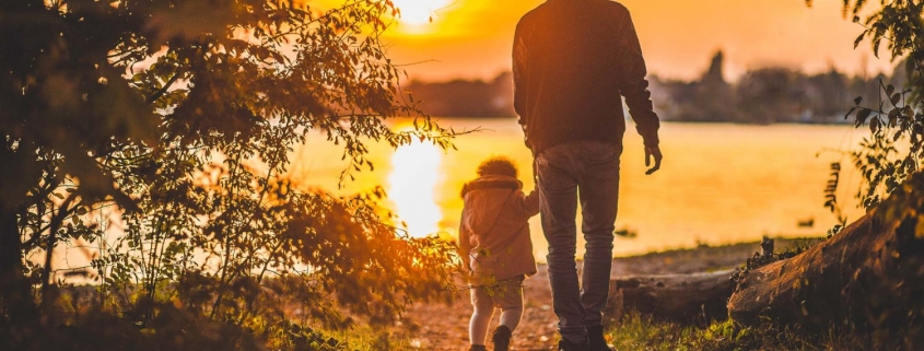Father and child at sunset