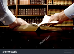 hands hold an old book