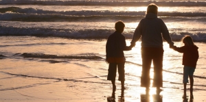 Mother and children at the beach