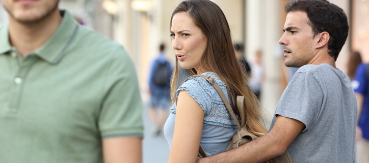 Disloyal woman looking at another man