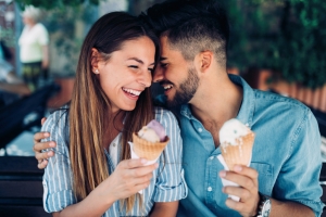 Happy couple eating ice cream