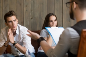 young couple meeting with psychologist
