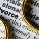 Two separate wedding rings next to the word "divorce"