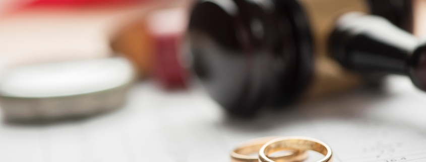 Gavel and wedding rings