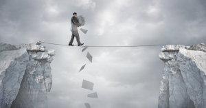 man balancing bills